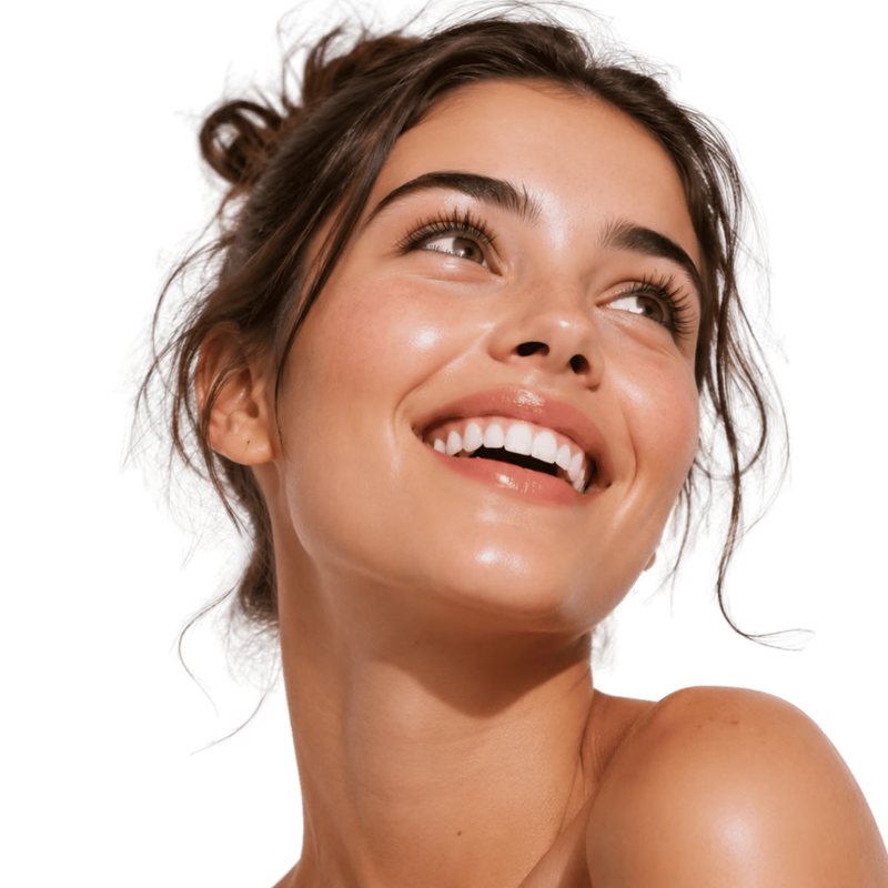 A close-up portrait of a smiling woman with dark brown hair looking upward, shown against a solid green background.